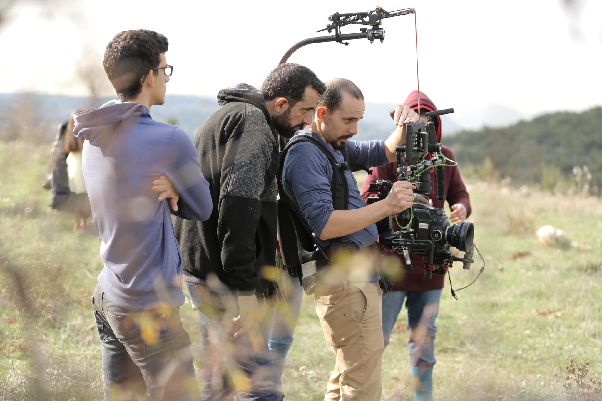 A Fine Line crew filming with a stabilised camera rig on location