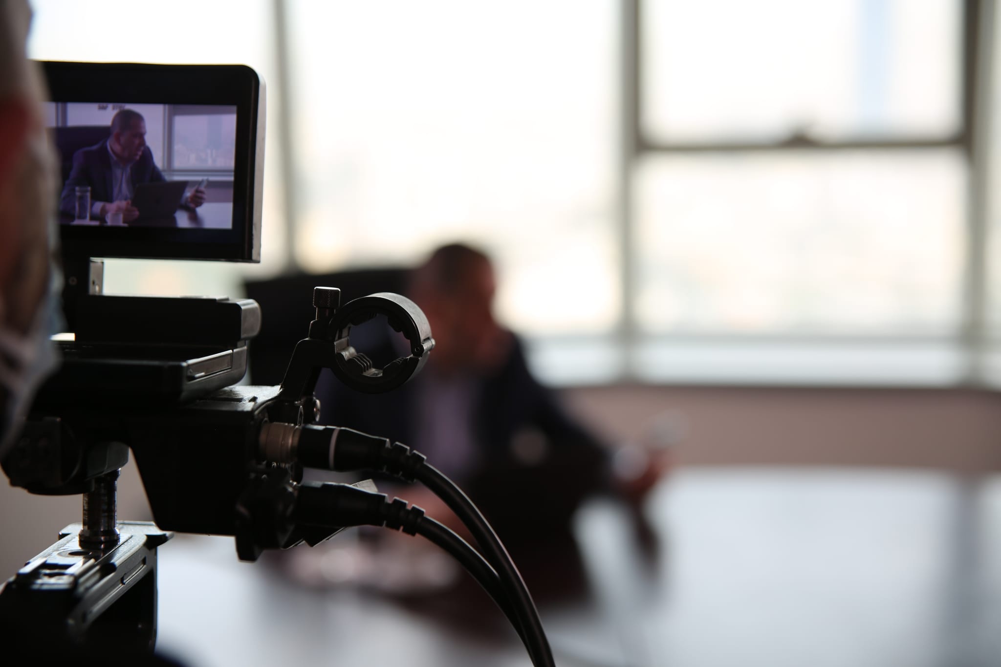 An interview seen through the camera monitor on a Fine Line shoot